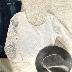 Cropped white shirt with sheer sleeves